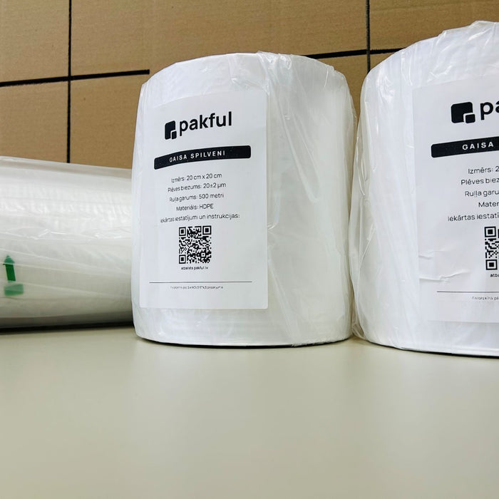 Two Pakful HDPE air cushion rolls on a warehouse table with product labels.