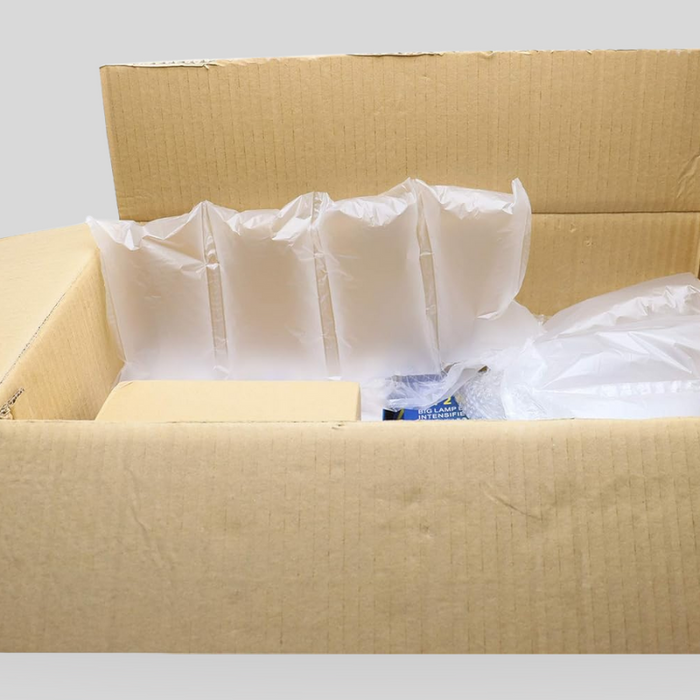 Cardboard box with air cushion packaging used for safe and space-efficient e-commerce shipping.