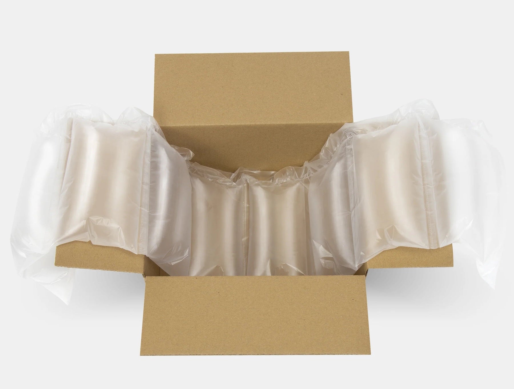 Air cushion packaging inside a cardboard box for product protection and void fill