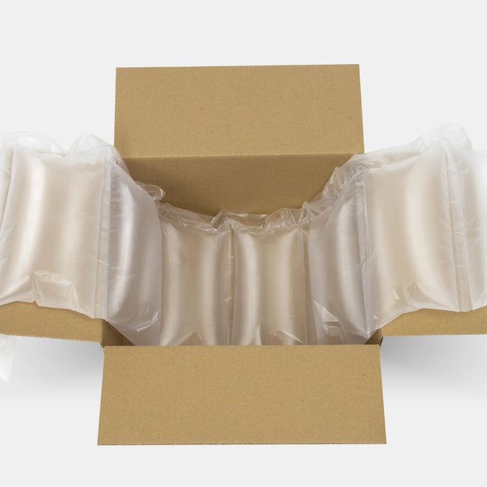 Air cushion packaging inside a cardboard box for product protection and void fill