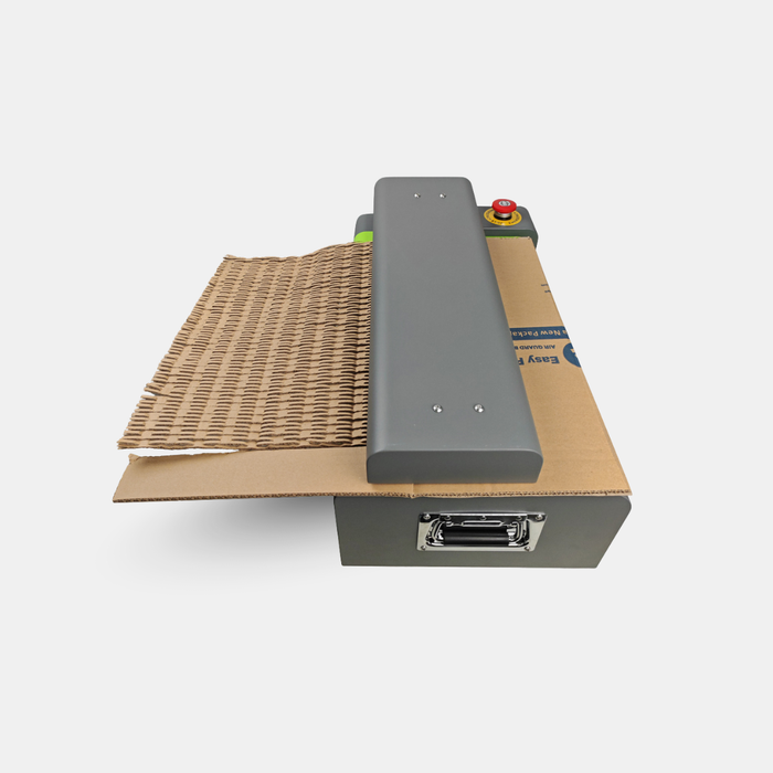 Top view of X70 cardboard shredder producing honeycomb-style cardboard padding