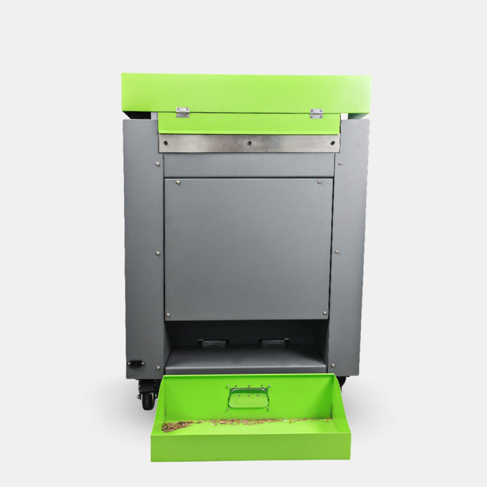Rear view of X73 cardboard recycling machine showing waste outlet and ventilation system