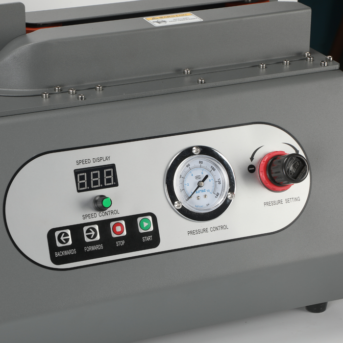 Close-up of Q20 machine control panel with pressure and speed settings