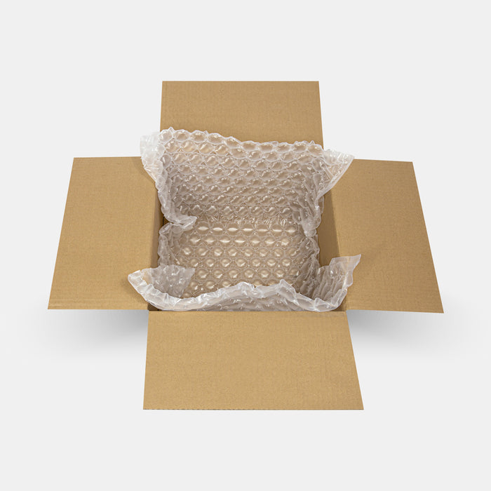 Open box with 570 × 320 mm air protective film roll and unrolled sheet